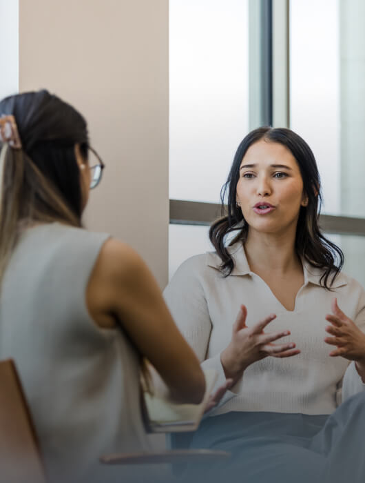 Co-workers having a conversation